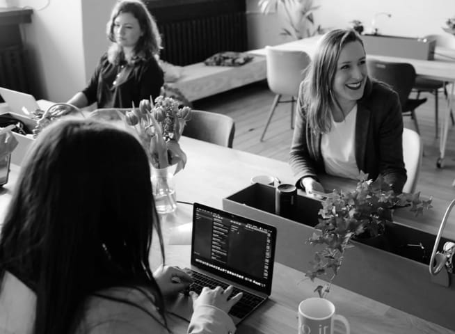 three ladies in an open office